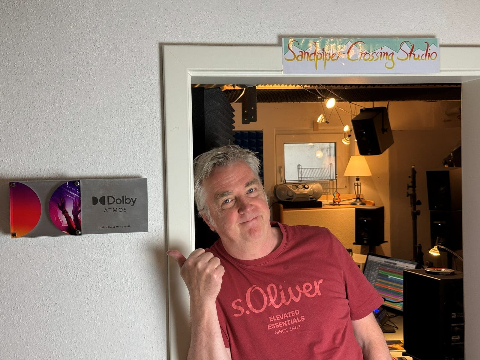 Peter Brümmer welcoming you at the door of Sandpiper Crossing Studio, beside its Dolby Atmos Music Studio certification